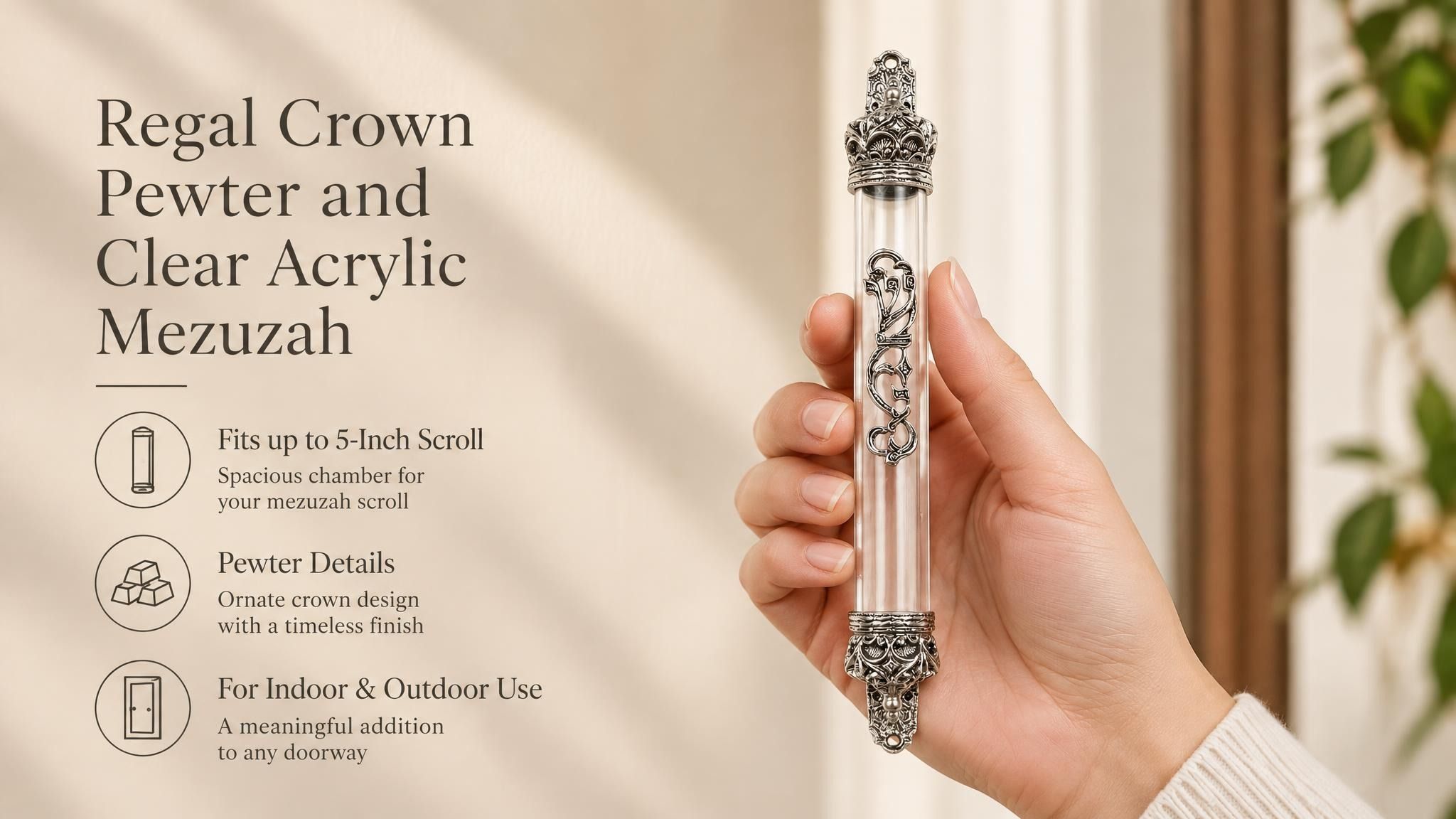 Regal Crown Pewter and Clear Acrylic Mezuzah mezuzah cover held upright in one hand, showing a transparent acrylic chamber framed by silver-toned pewter crown ends, dark recessed decoration and curling silver scrollwork down the front beside the product name and illustrated design features in a wide social-sharing graphic for decorative Jewish home Judaica