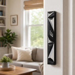 Indoor lifestyle image of the Cyber Prism Black Geometric Mezuzah mounted on a doorpost in a home entrance.