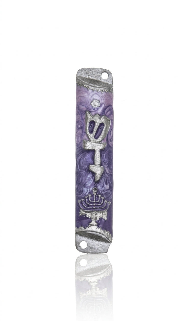 Pewter mezuzah with menorah design and Hebrew inscription, mounted vertically on a white background with subtle reflection.