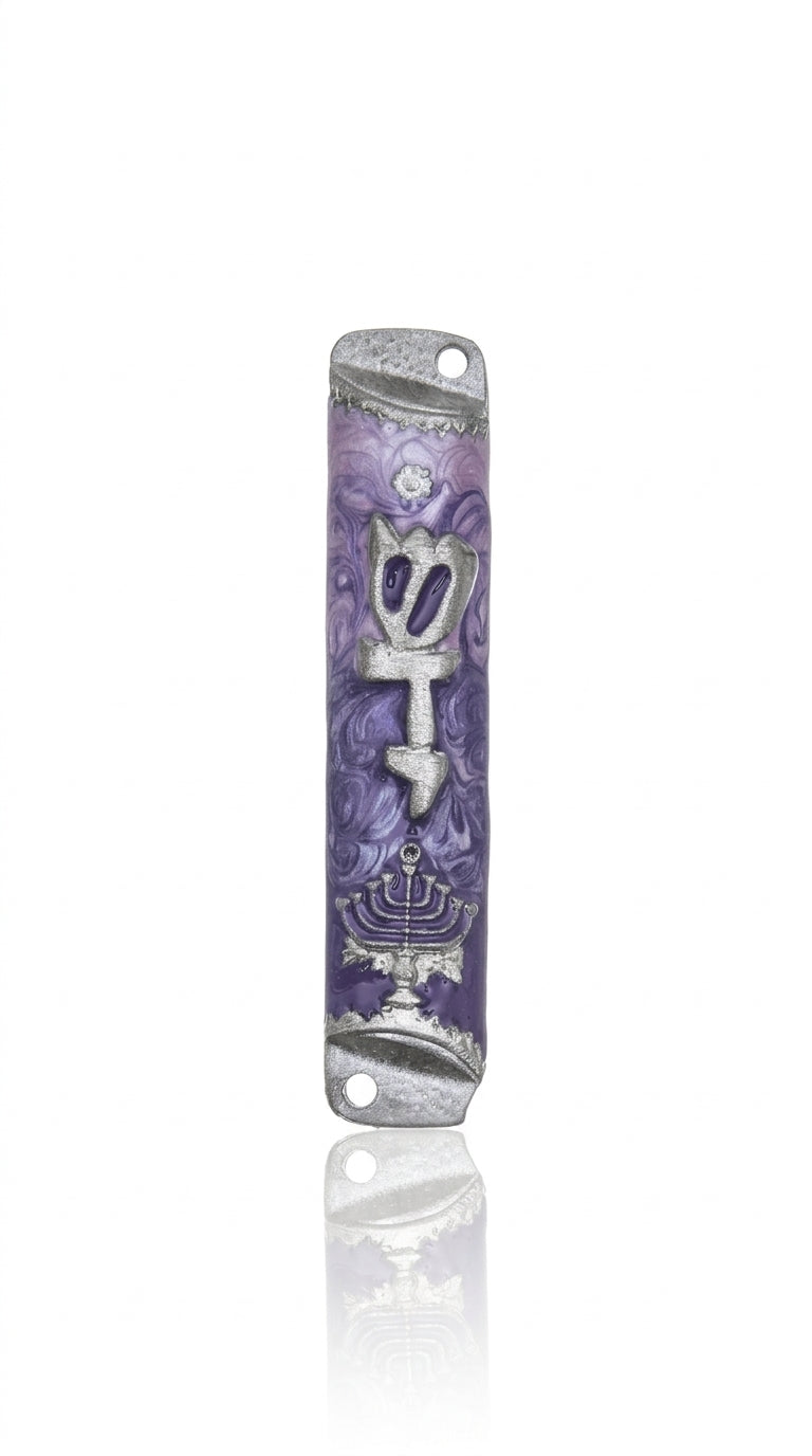 Pewter mezuzah with menorah design and Hebrew inscription, mounted vertically on a white background with subtle reflection.