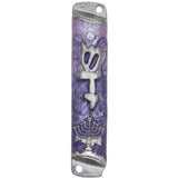 Pewter mezuzah with menorah design and Hebrew inscription, mounted vertically on a white background with subtle reflection.