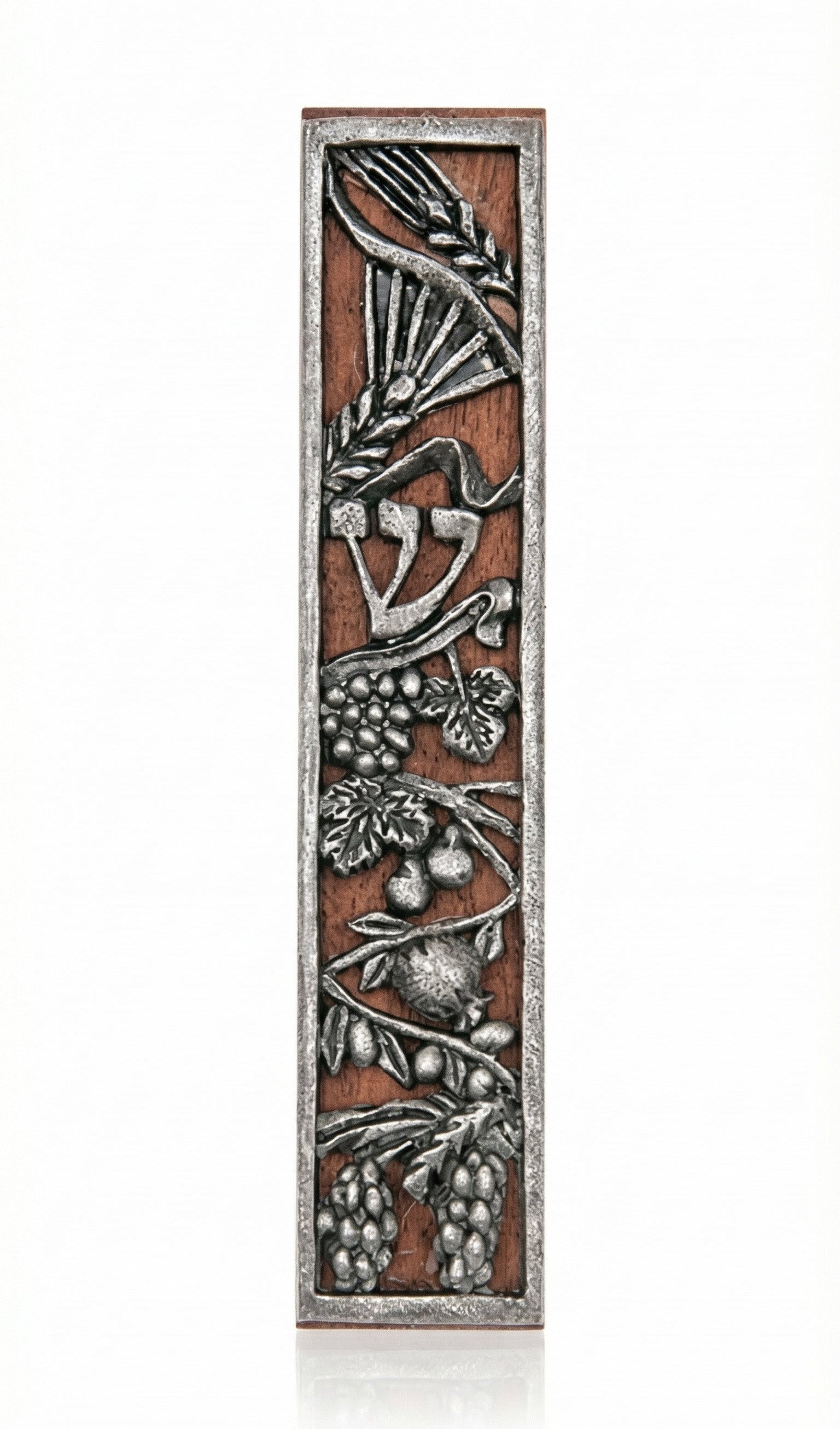 Rustic seven species mezuzah made of wood and pewter with detailed engravings, suitable for mounting on home doors in a bright studio setting.
