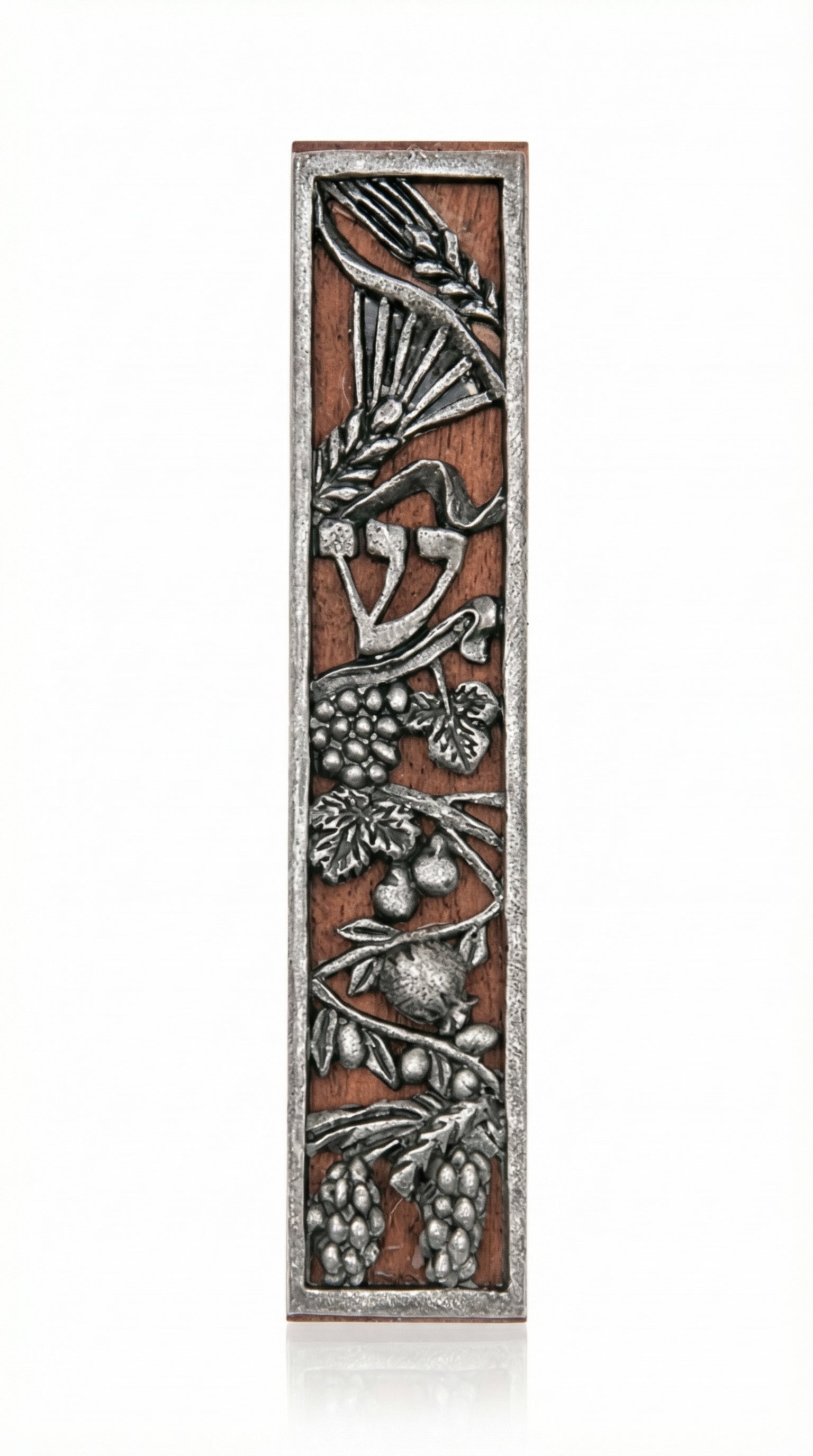 Rustic seven species mezuzah made of wood and pewter with detailed engravings, suitable for mounting on home doors in a bright studio setting.