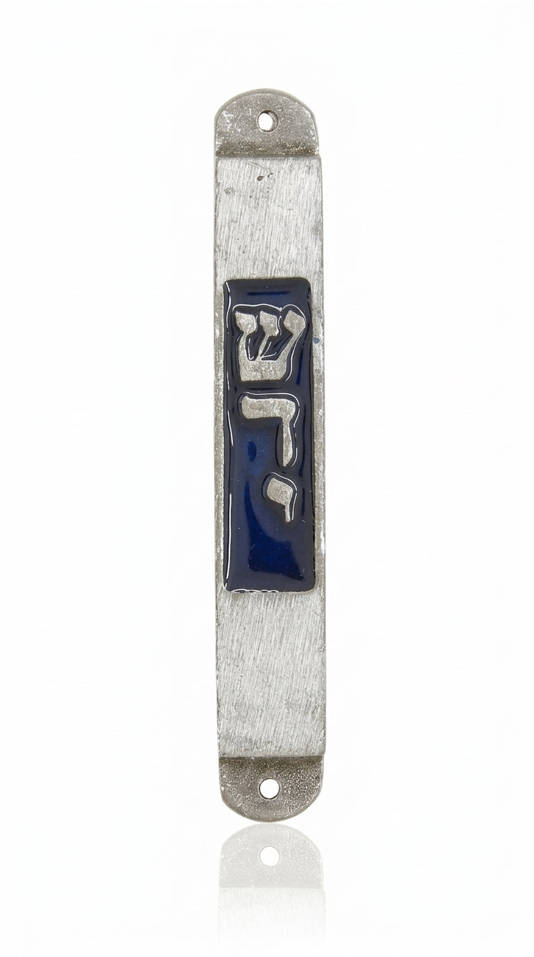 High-resolution image of a simple, handsome pewter mezuzah with minimalist design, clear engraved details, and a polished white studio background with a soft reflection.