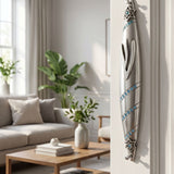 Hyper-realistic scene showing sapphire trail pewter mezuzah on the right side inside a stylish home doorway with warm lighting and elegant decor.