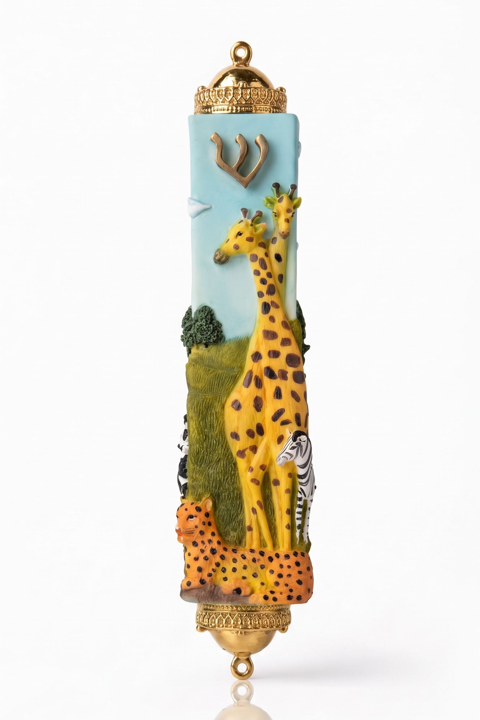 Savannah Safari Fimo Mezuzah shown from the front as a mezuzah cover featuring a pale blue Fimo body with tall yellow giraffes, a zebra, spotted animals, green scenery and a gold-colored Hebrew Shin beneath decorative brass fittings, presenting a detailed Judaica design for a Jewish home doorway