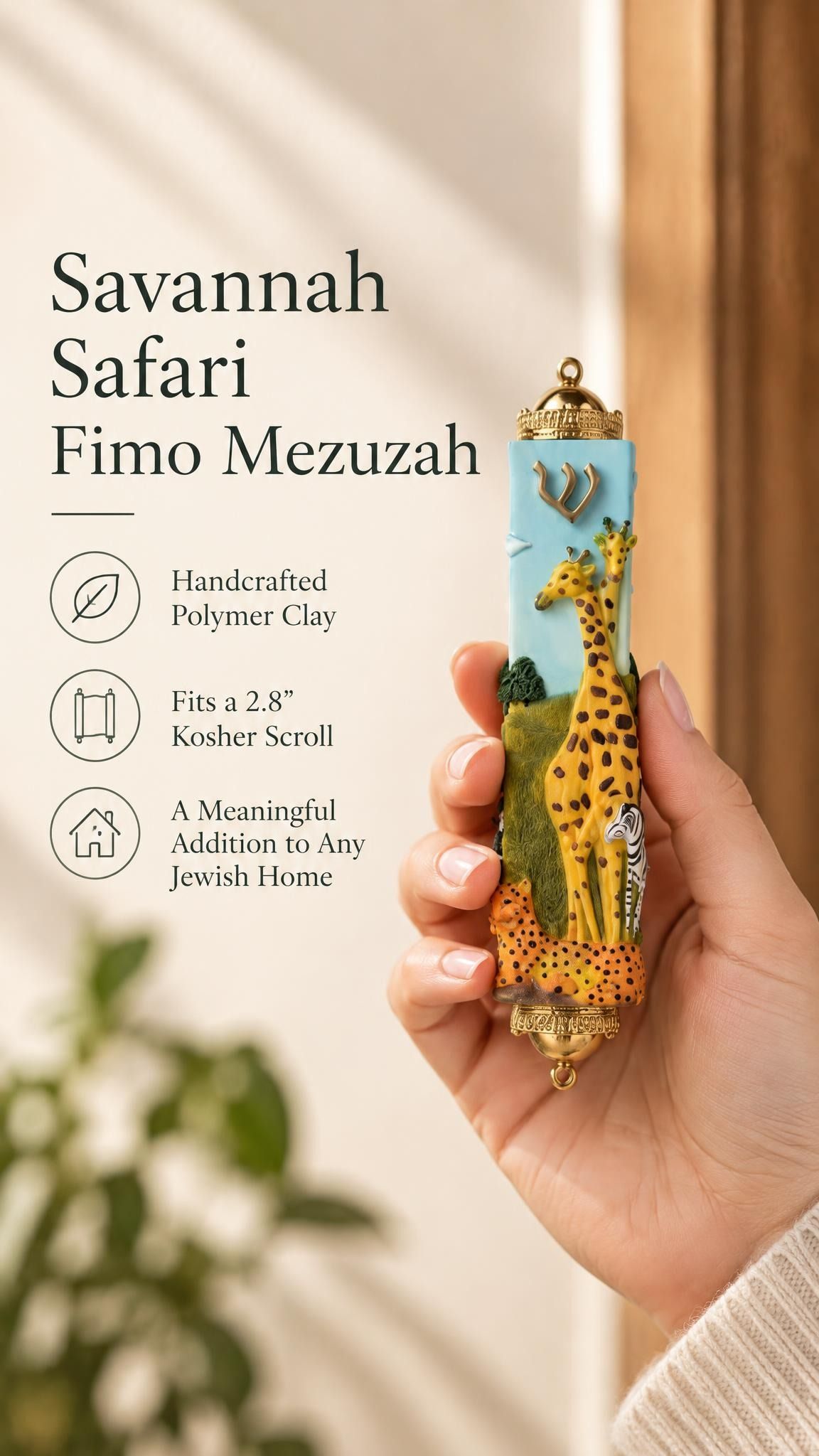 Handheld portrait of the Savannah Safari Fimo Mezuzah mezuzah cover, with yellow giraffes, a zebra and spotted animals against a pale blue Fimo body, with green scenery, a gold-colored Shin and decorative brass fittings clearly visible beside the product name and illustrated features of this distinctive Jewish doorway design