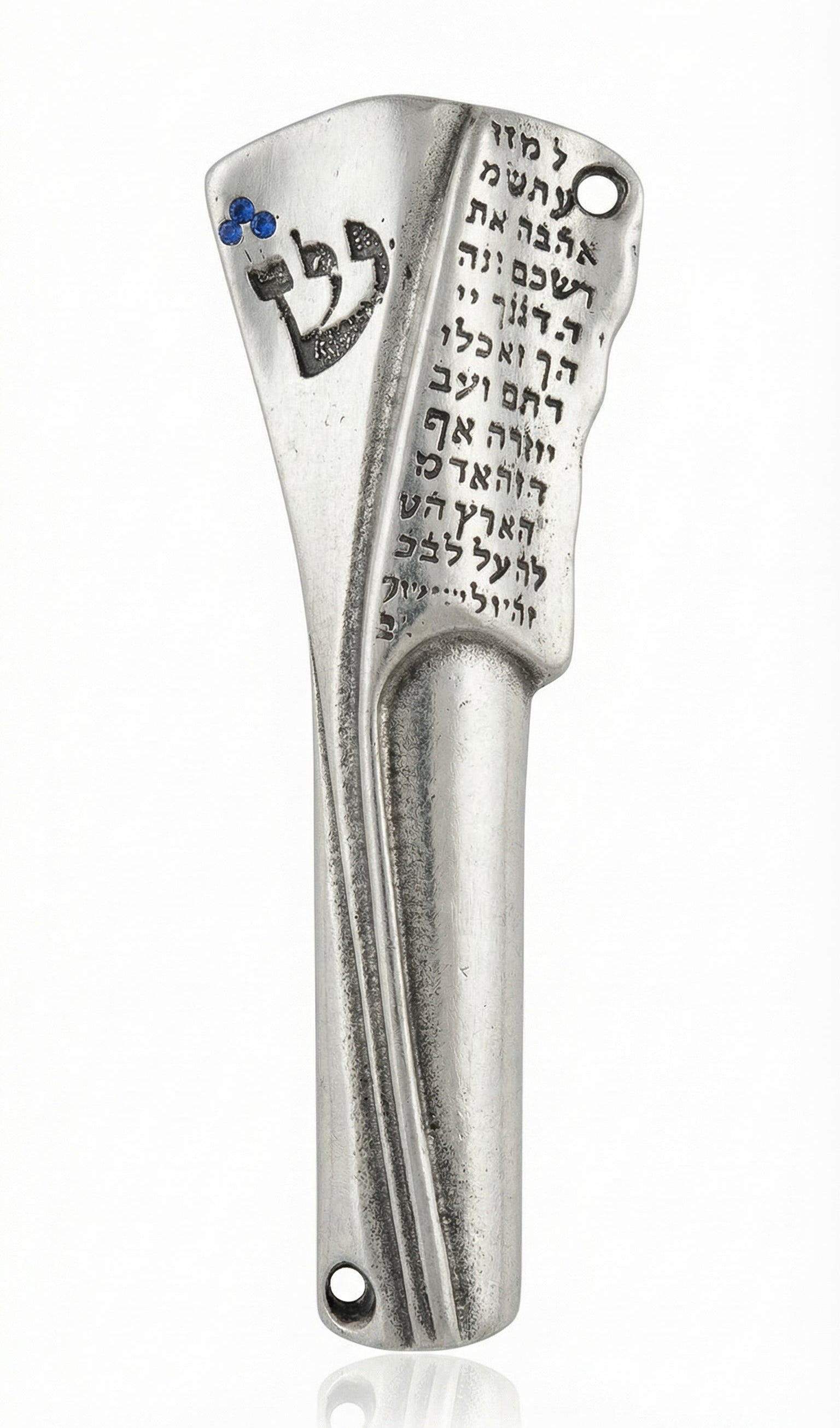 Upscale photo of an engraved pewter Mezuzah 4.5 inches tall with Hebrew script and crowned Shin with blue stones, on a polished white surface.