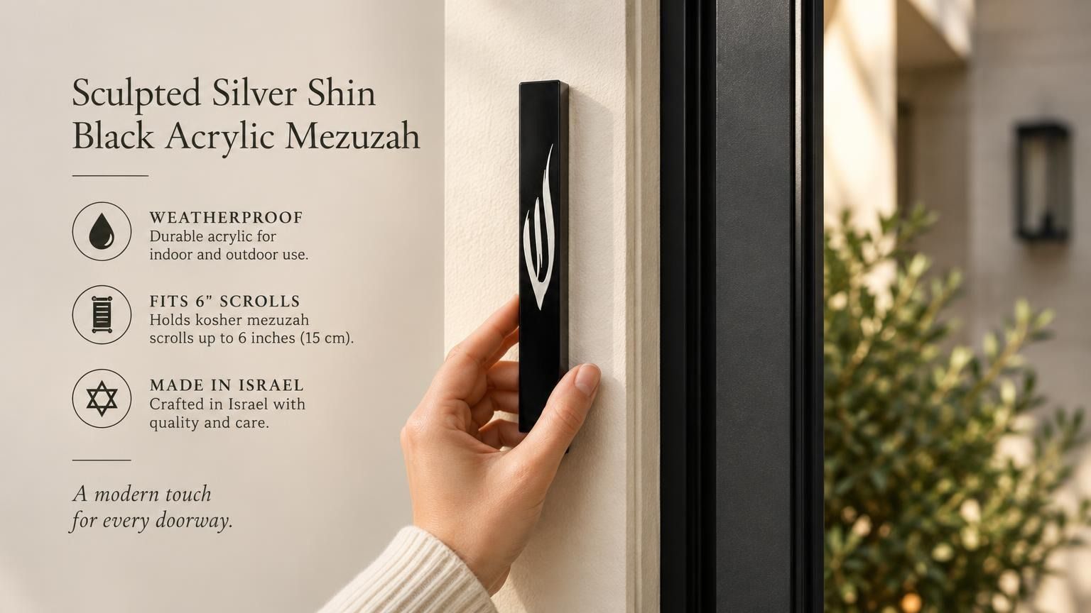 Large black acrylic mezuzah cover mounted vertically on a light-colored front doorpost, showing its slim profile and contrasting silver Shin