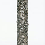 High-quality Seven Species Mezuzah made of pewter with Swarovski stones, measuring 6 inches long by 1.6 inches wide, displayed on a white studio surface with soft reflection.