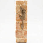 Jerusalem stone Mezuzah with Hebrew Sha-dai, handcrafted in Israel, showcasing surface texture and natural color variations.
