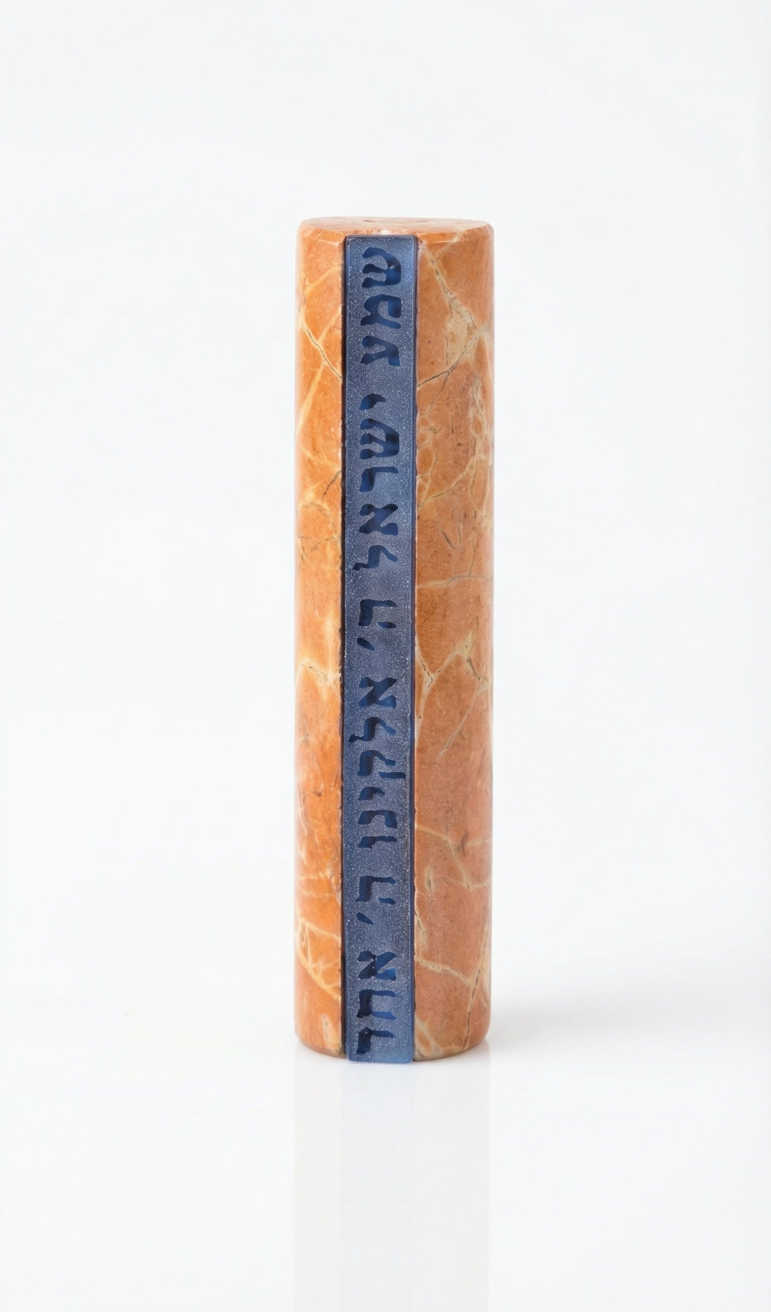 Shema Mezuzah crafted from Jerusalem stone with inlaid glass strip bearing Hebrew prayer, mounted on a white studio background with subtle reflection.
