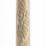 Handcrafted Jerusalem stone Mezuzah with Hebrew inscriptions on a polished white surface, showing natural texture and surface details.