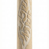 Handcrafted Jerusalem stone Mezuzah with Hebrew inscriptions on a polished white surface, showing natural texture and surface details.