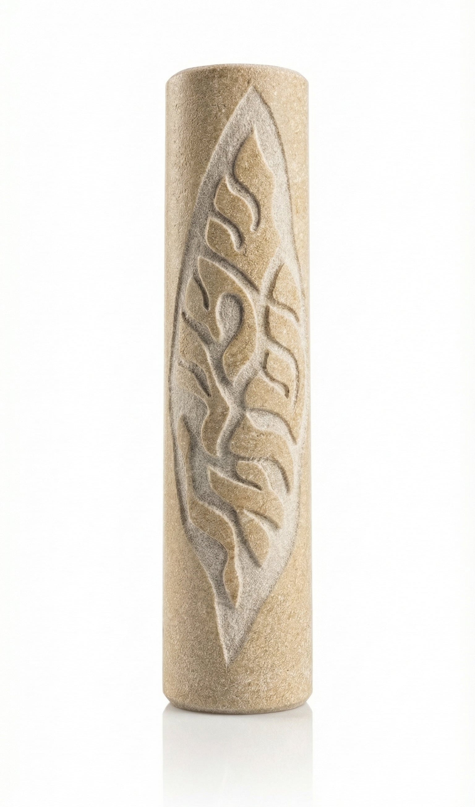 Handcrafted Jerusalem stone Mezuzah with Hebrew inscriptions on a polished white surface, showing natural texture and surface details.