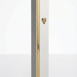 Modern aluminum mezuzah with matte silver surface and golden stripe accents for contemporary Jewish homes