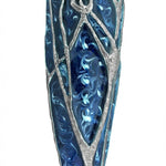 Detailed pewter mezuzah featuring a stylized tree of life in shades of blue, with a white background and soft reflection for a polished studio look.