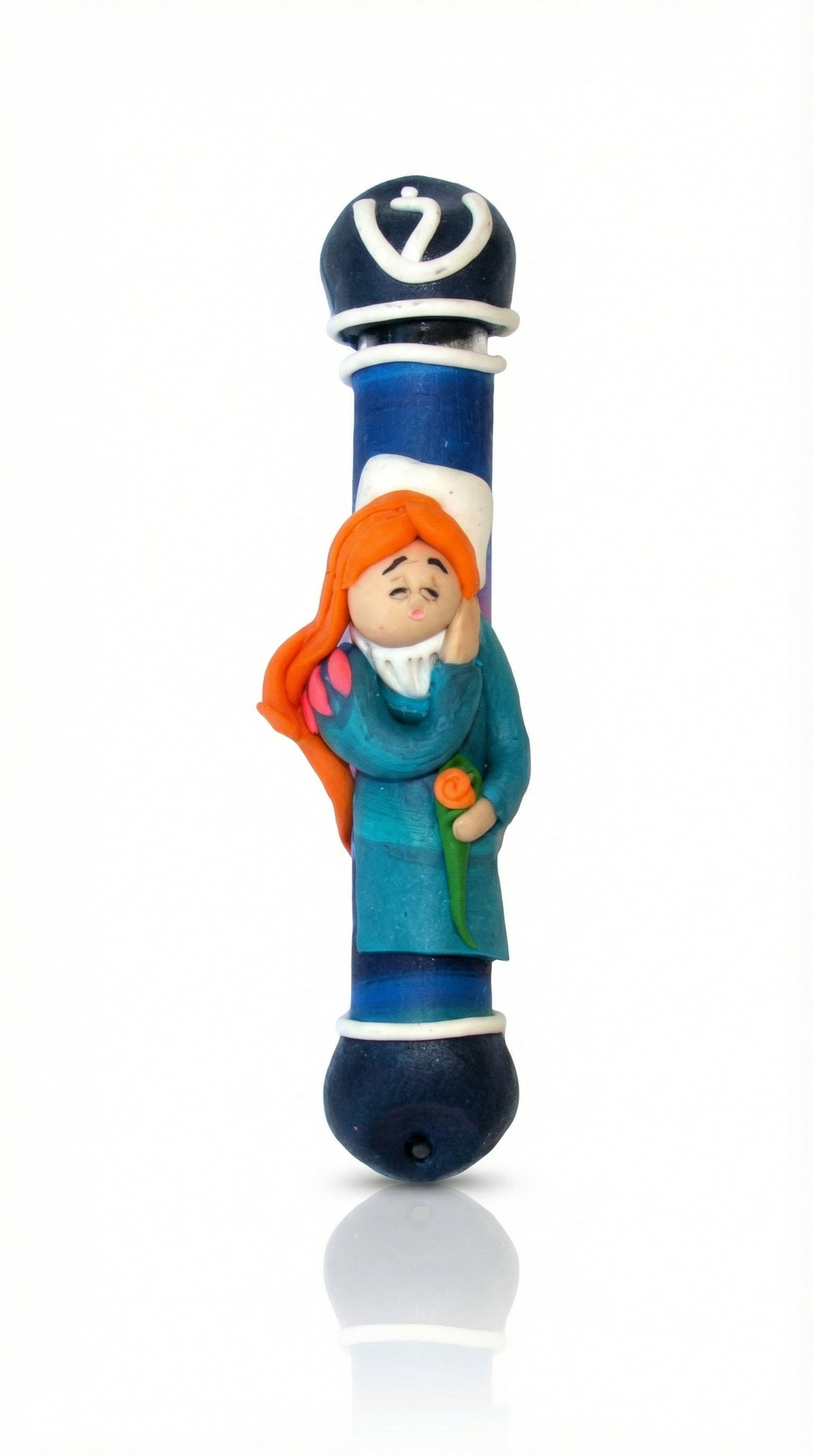 Walking beauty resting peacefully on a sweet Fimo mezuzah, designed for children, with a bright white background and soft reflection.