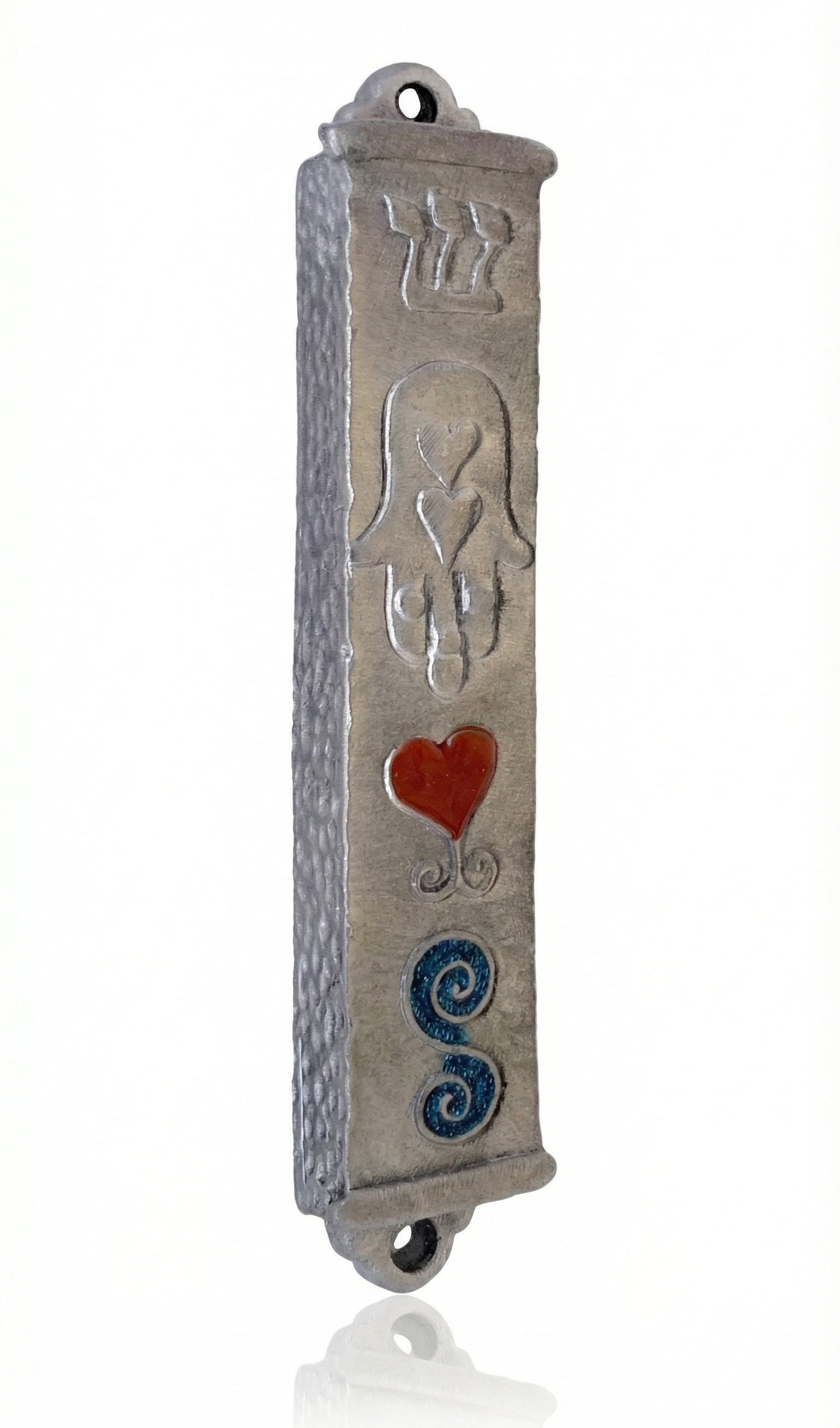 Petite Moroccan style pewter mezuzah with Hebrew engravings and decorative motifs, displayed on a white studio background with subtle reflection.