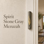 Gray Jerusalem stone mezuzah with gold Shin symbol, handcrafted in Israel, for spiritual home decor.