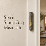 Gray Jerusalem stone mezuzah with gold Shin symbol, handcrafted in Israel, for spiritual home decor.