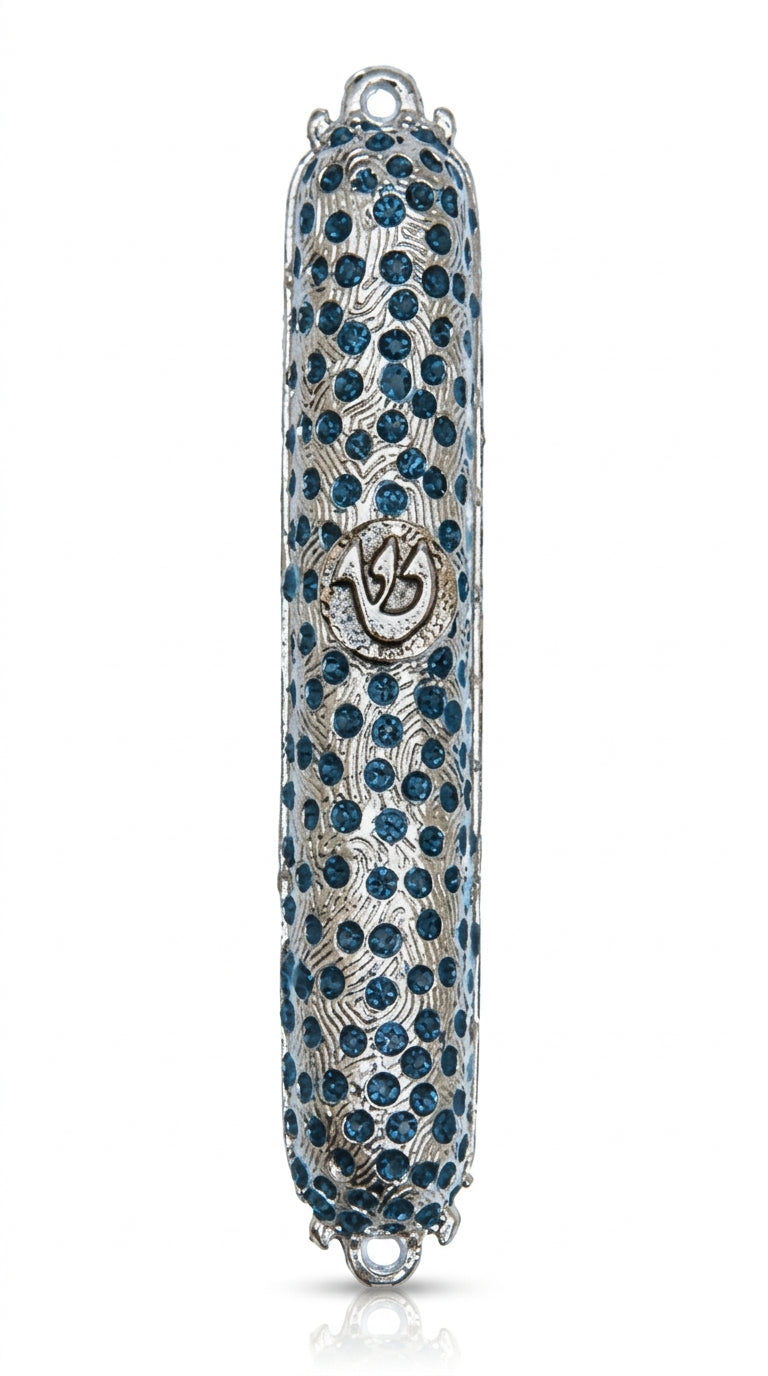 High-resolution image of a pewter Spot of Rain Mezuzah with Hebrew engravings, clear details, on a white studio background with soft reflection.