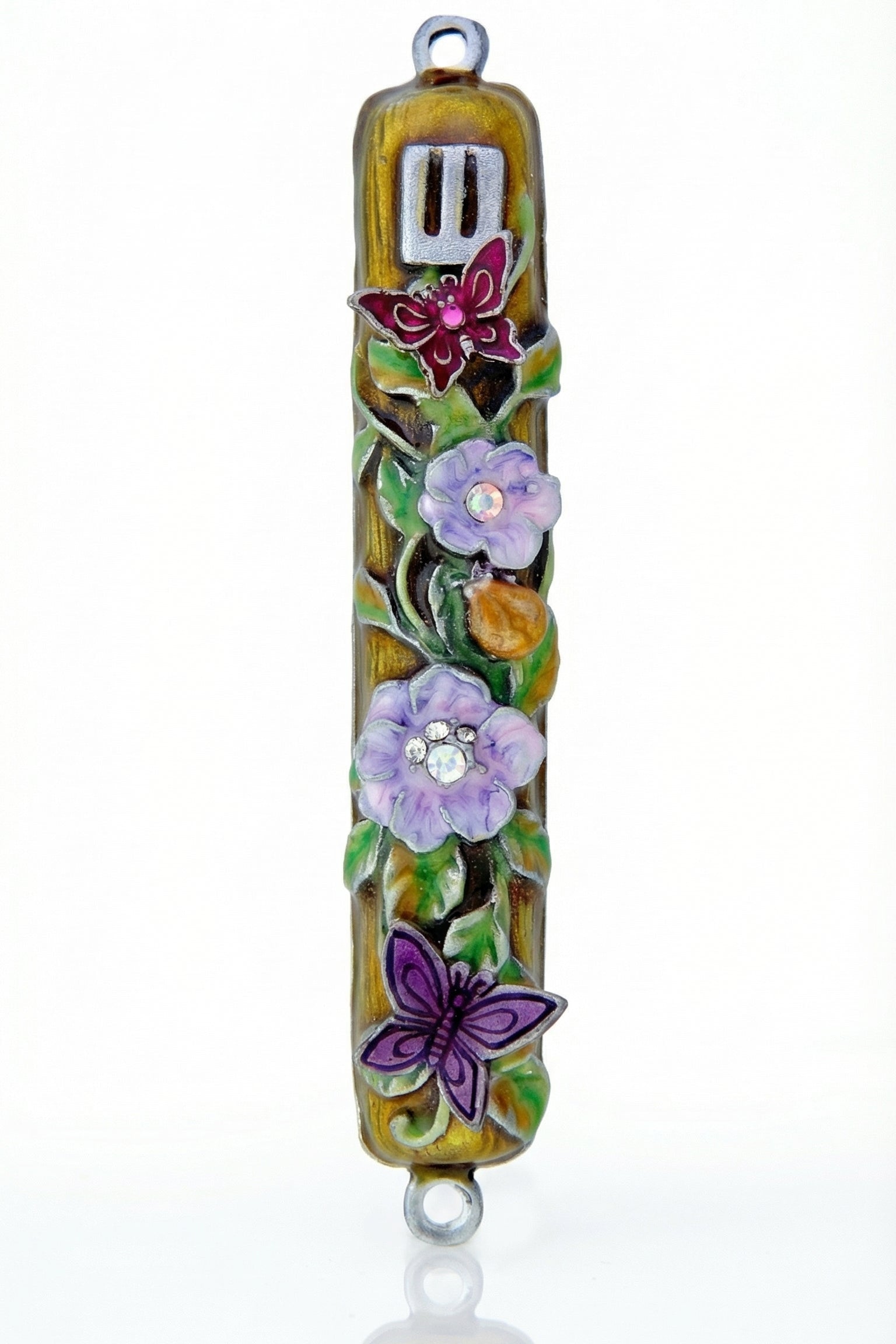 Uplifting pewter mezuzah decorated with dewy violet blossoms, fluttering butterflies, and a hidden ladybug, with a white studio background and soft reflection.