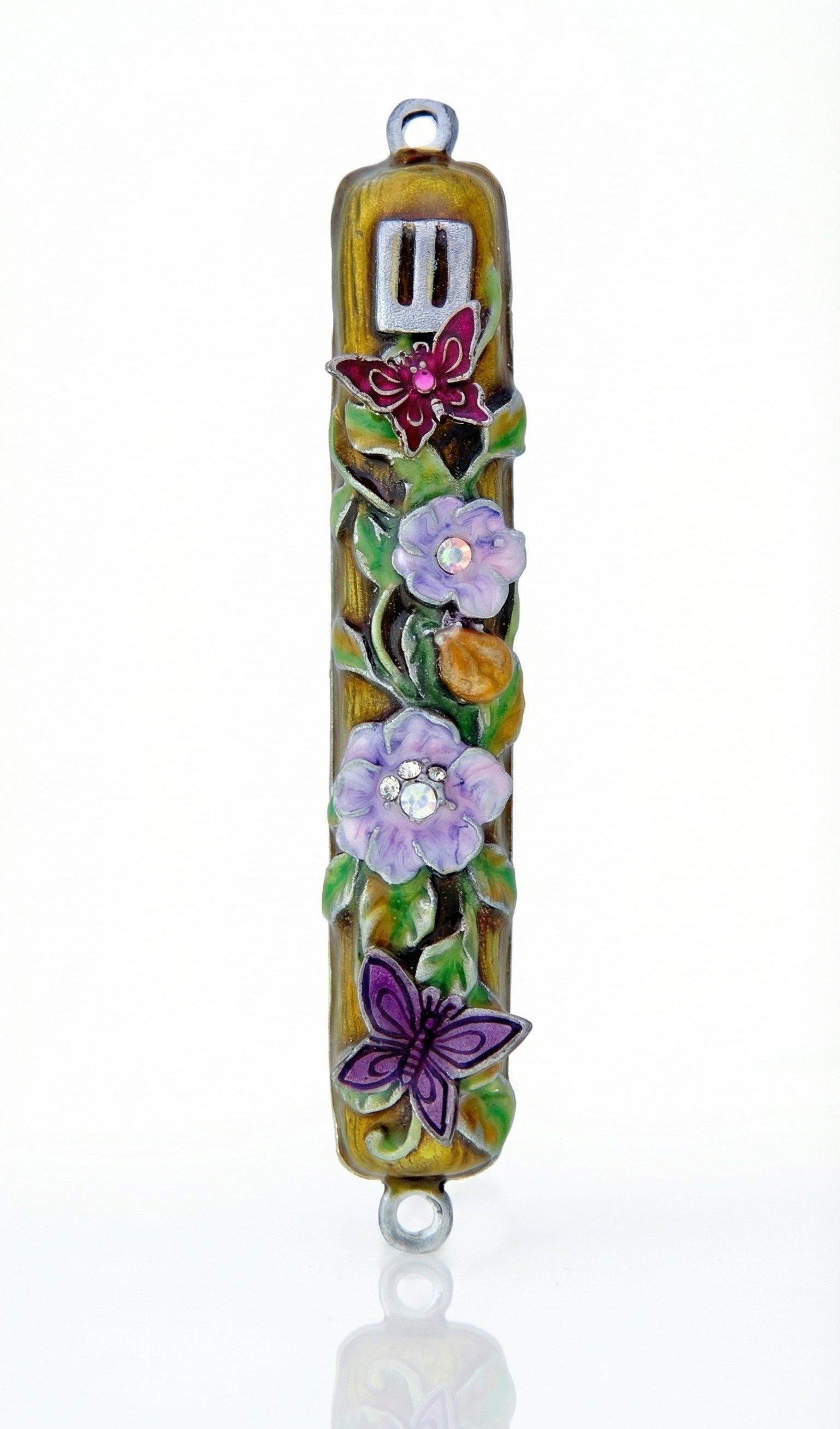 Uplifting pewter mezuzah decorated with dewy violet blossoms, fluttering butterflies, and a hidden ladybug, with a white studio background and soft reflection.