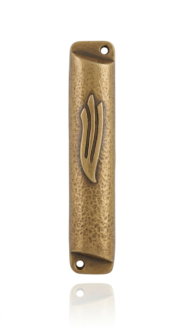 Square brass mezuzah case with antique finish, 4 inches tall, detailed engravings, Hebrew letters, mounted on a white background with soft reflection.