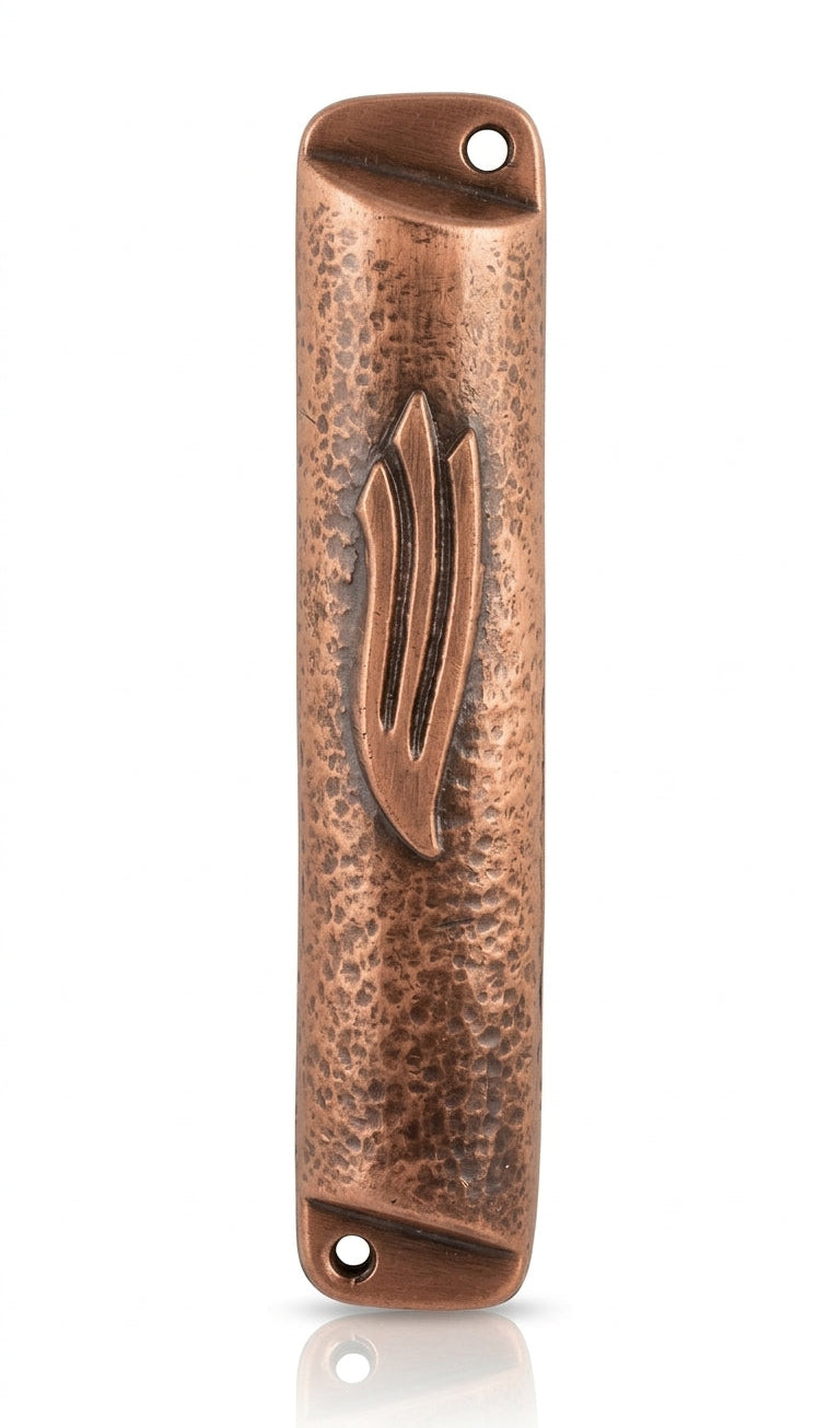 Petite square copper mezuzah with antique finish, shown on a clean white background with soft reflection, emphasizing intricate details and craftsmanship.