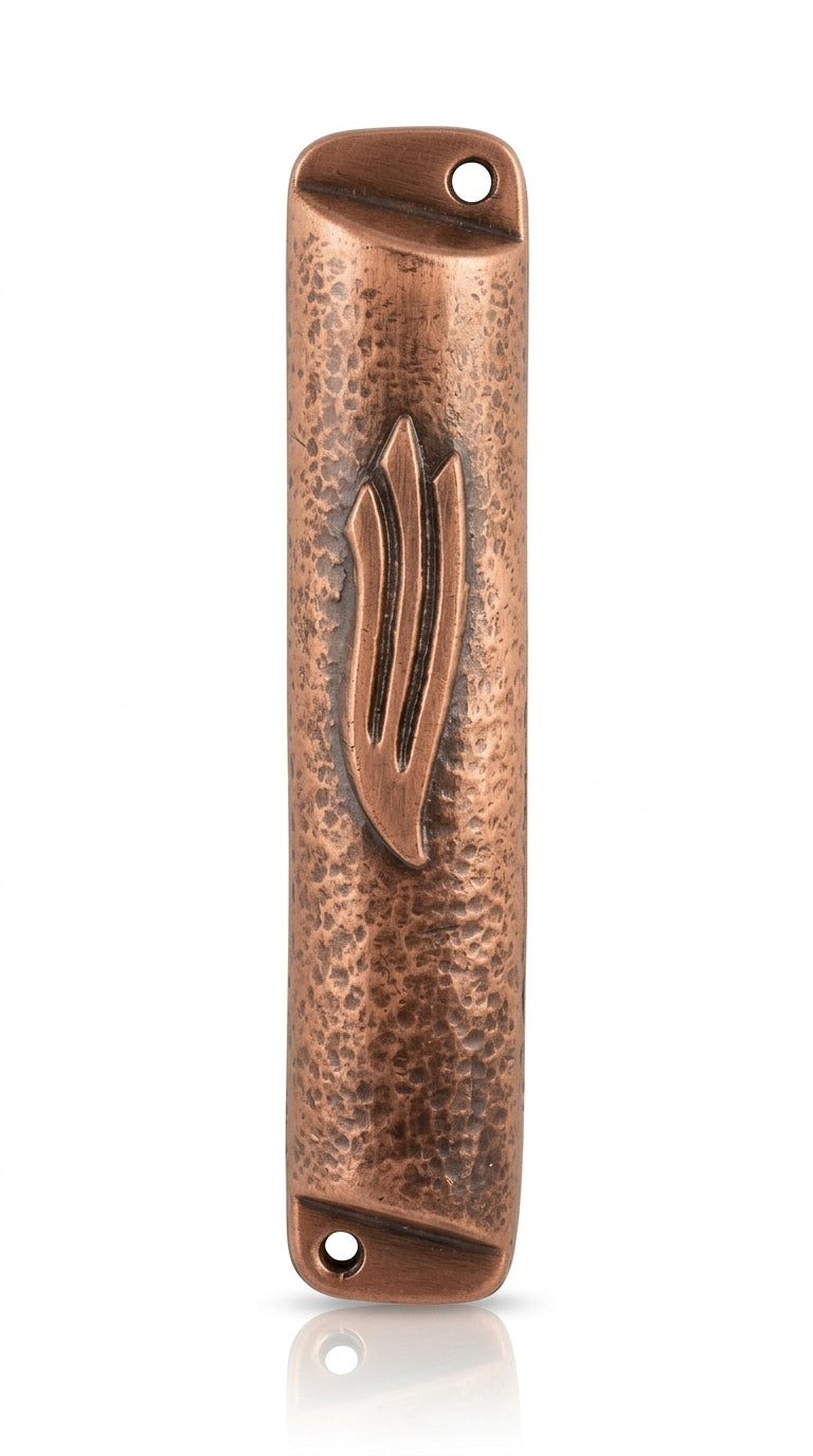 Petite square copper mezuzah with antique finish, shown on a clean white background with soft reflection, emphasizing intricate details and craftsmanship.