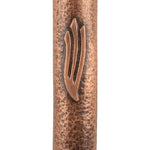 Petite square copper mezuzah with antique finish, shown on a clean white background with soft reflection, emphasizing intricate details and craftsmanship.