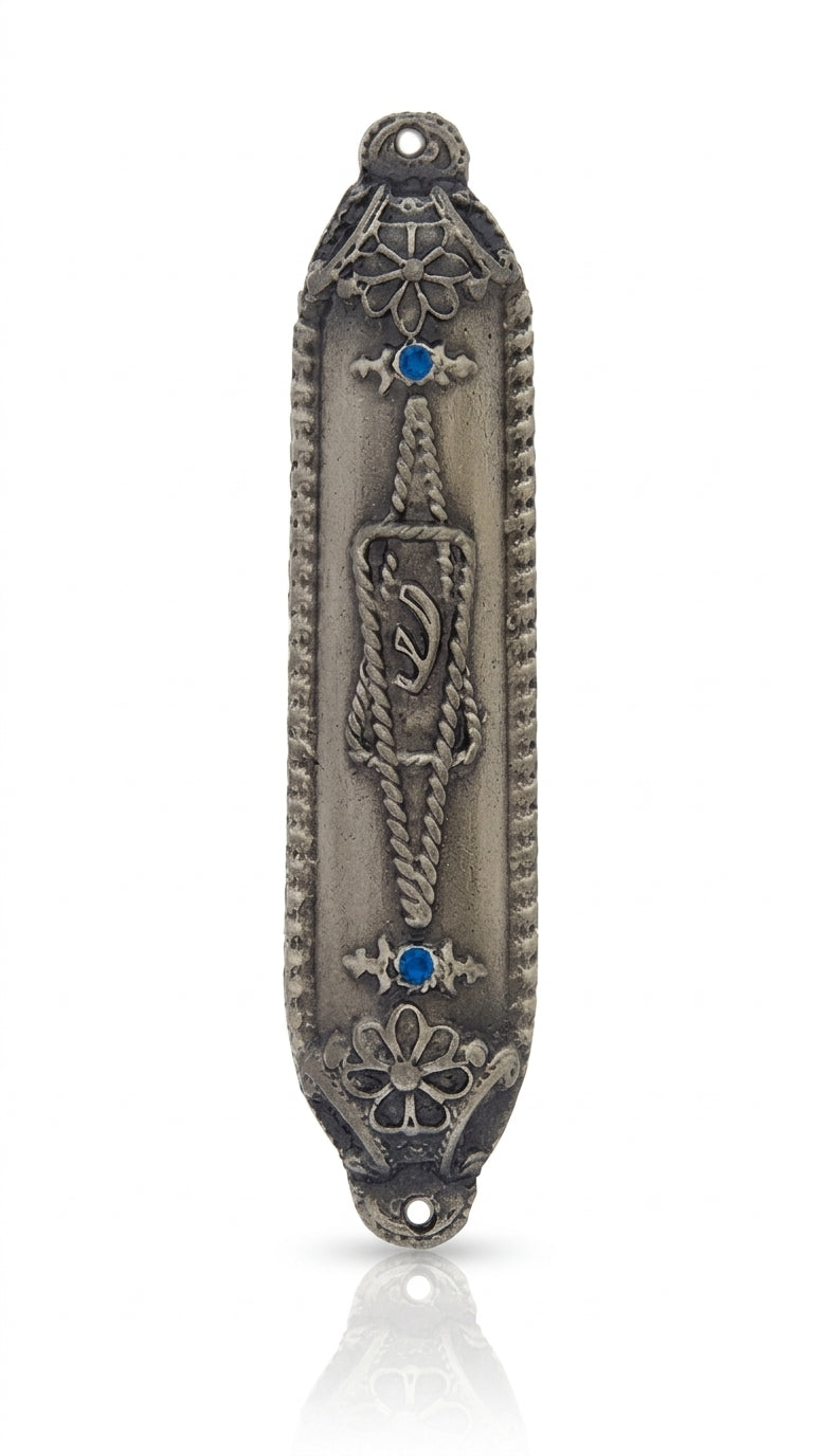 High-resolution image of a detailed Star of David Mezuzah with Hebrew engravings, set against a pure white background with a subtle reflection.