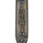 High-resolution image of a detailed Star of David Mezuzah with Hebrew engravings, set against a pure white background with a subtle reflection.