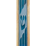 Stone and glass mezuzah with inlaid frosted 'Shin' letter, mounted on a white background with soft reflection, showcasing detailed craftsmanship.