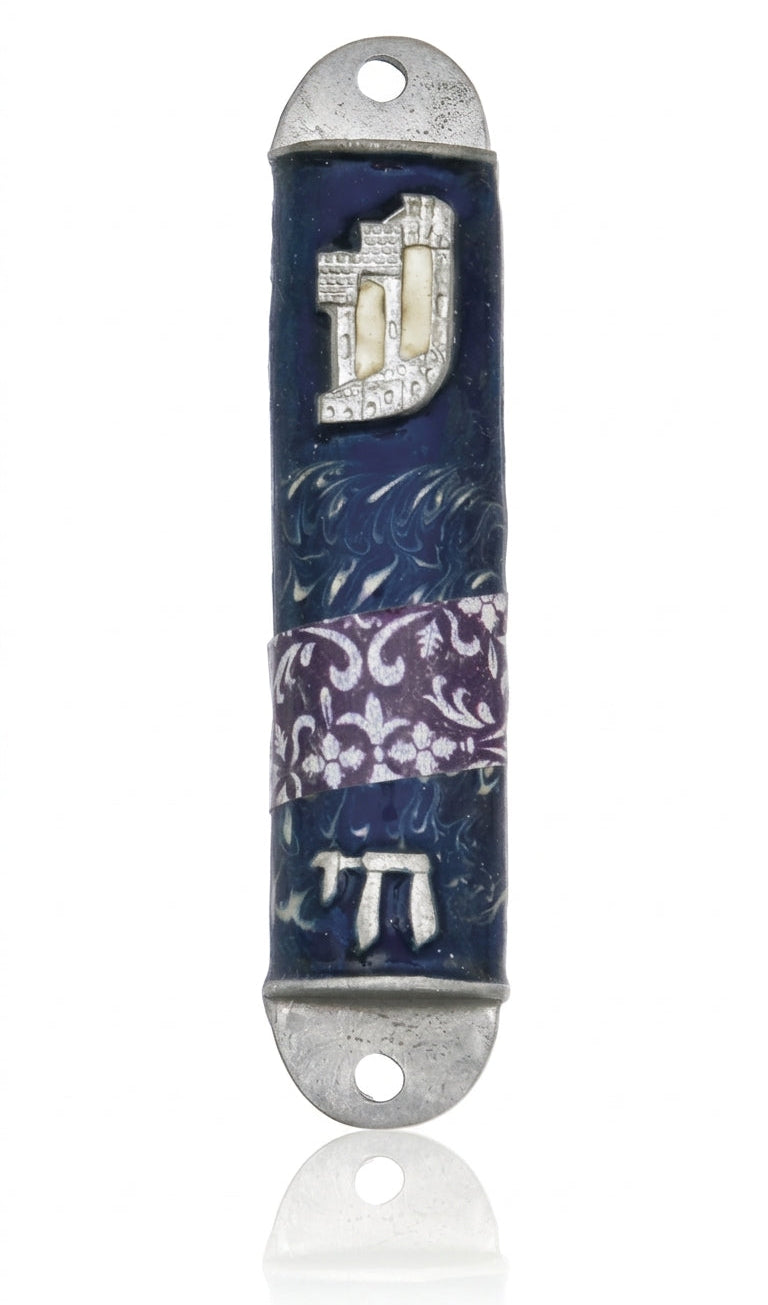 High-resolution image of a pewter Mezuzah featuring the stylized letter Shin and the word Chai, on a bright white studio background with subtle reflection.