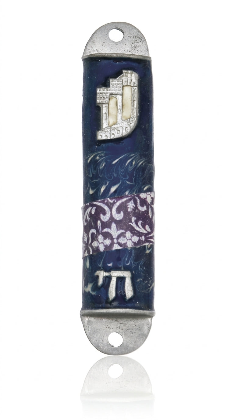 High-resolution image of a pewter Mezuzah featuring the stylized letter Shin and the word Chai, on a bright white studio background with subtle reflection.