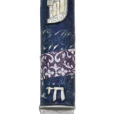 High-resolution image of a pewter Mezuzah featuring the stylized letter Shin and the word Chai, on a bright white studio background with subtle reflection.