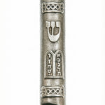 Upscale, detailed image of a Ten Commandments Mezuzah with all intricate design elements, Hebrew inscriptions, and surface textures clearly visible on a white studio background with subtle reflection.