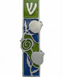 Pewter mezuzah with pomegranate motif, Hebrew script, detailed design, on a white studio background with subtle reflection.