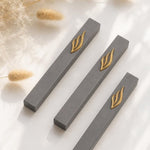 Three minimalist Modern charcoal gray and gold aluminum mezuzah cases