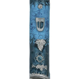 Pewter mezuzah with enamel paint, featuring a floating leaf on a blue background, displayed on a white studio surface with soft reflection.