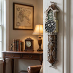 Close-up of Timeless Clock mezuzah with hand-painted clock motif, vine accents, pewter texture, and Hebrew letter Shin.