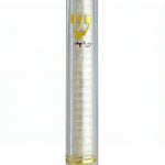 Close-up of a 6-inch clear lucite mezuzah on white background with reflection, emphasis on clarity and details.