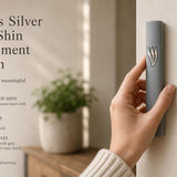 A person holds a 6-inch gray cement mezuzah with a silver Shin letter, showcasing its modern design and architectural scale