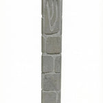 High-quality handcrafted Jerusalem stone mezuzah with carved Shin symbol, textured natural grey stone, in a white studio background with soft reflection.