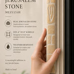 Close-up of the undecorated cream Jerusalem stone mezuzah showing natural fossil flecking.