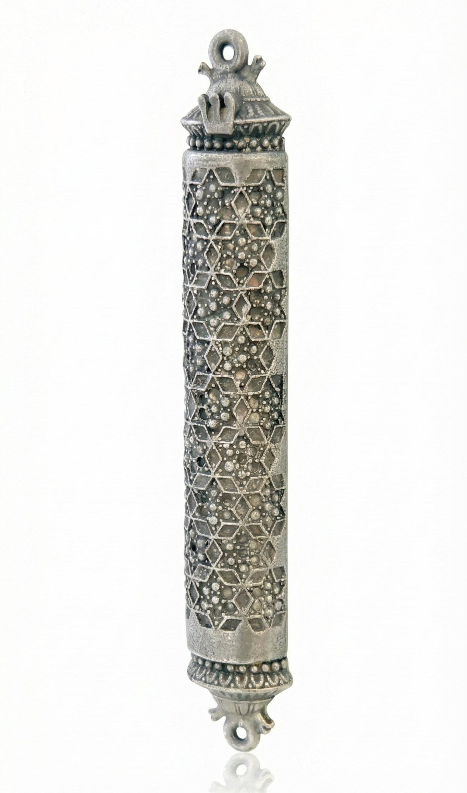 Ornate pewter mezuzah with detailed Magen David design and decorative textured surface, mounted on a neutral white background with subtle reflection.
