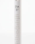 Scripted Shema white acrylic mezuzah case on a white background with raised Hebrew text, a silver Shin and Torah scroll emblem, and top and bottom mounting recesses