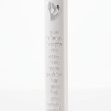 Scripted Shema white acrylic mezuzah case on a white background with raised Hebrew text, a silver Shin and Torah scroll emblem, and top and bottom mounting recesses